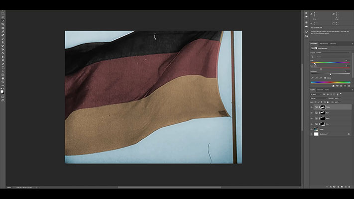 Colorized keyframe of a German flag being color-corrected in Adobe Photoshop